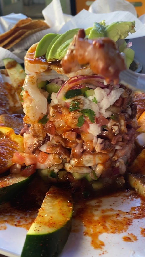 Family-style Mexican restaurant interior with table service.