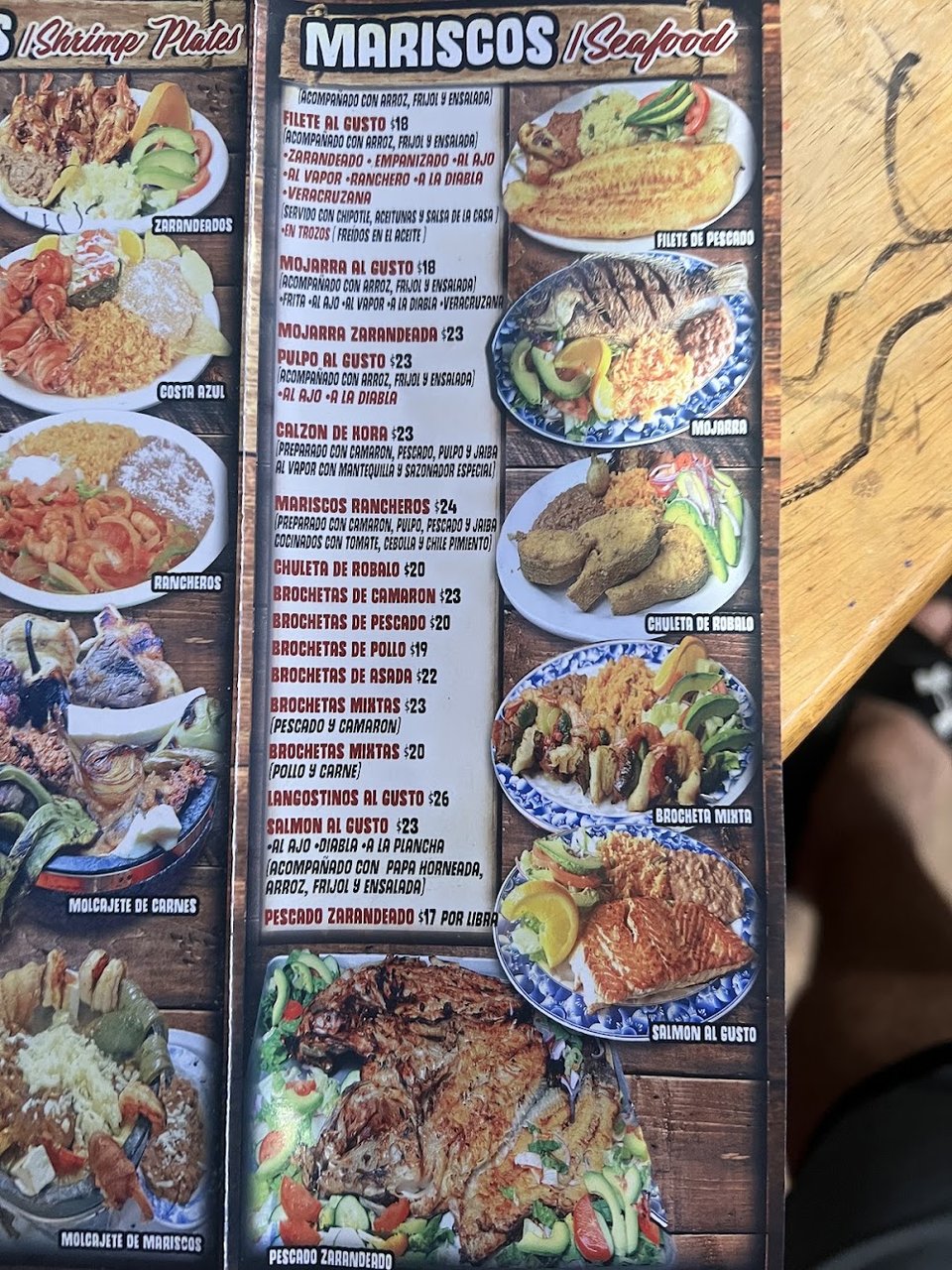 Printed menu with seafood plates and appetizers.